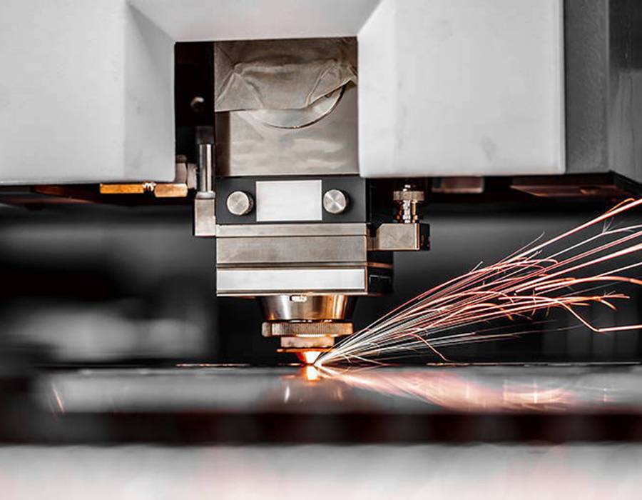 CNC Laser cutting of metal, modern industrial technology. Small depth of field. Warning - authentic shooting in challenging conditions. A little bit grain and maybe blurred.